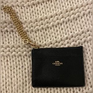 Coach wristlet, black & gold, lightly used. Perfect size for credit cards & ID’s